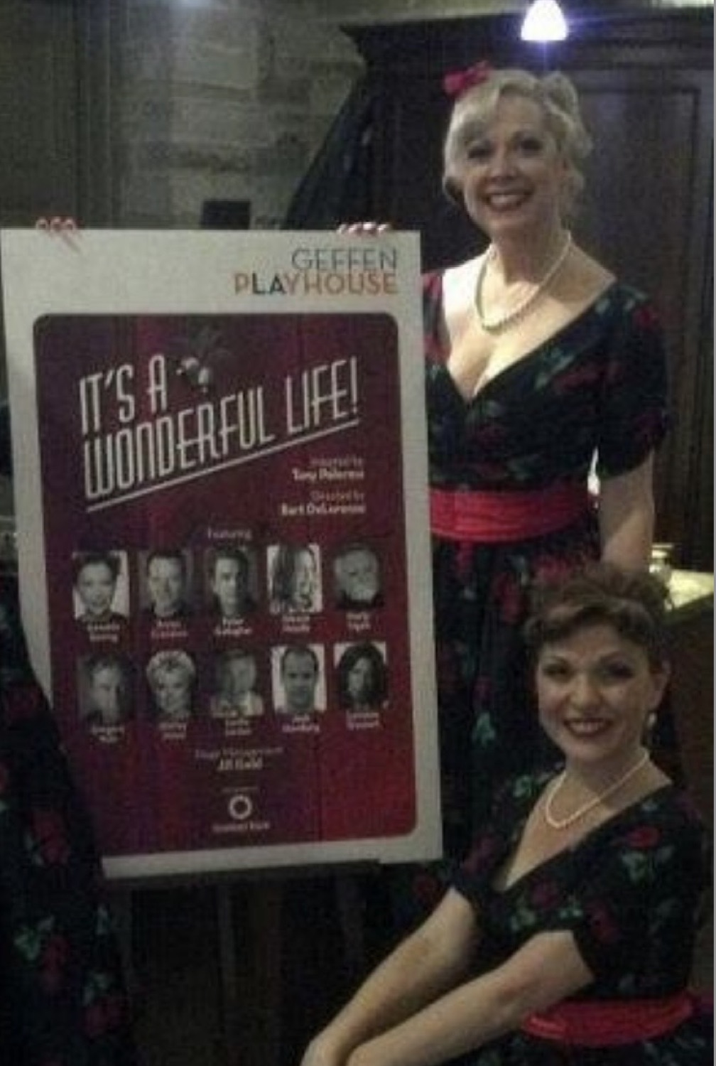 The Chantillys beside the Geffen Playhouse 'It's a Wonderful Life!' poster